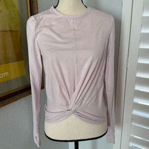 Lightweight long-sleeve athletic tee with twisting detail at core.